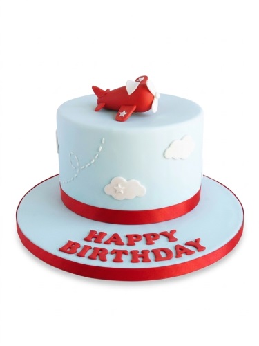 Light blue single-tier birthday cake with a red airplane topper, white clouds, and a red ribbon. The cake board has "Happy Birthday" in red letters.