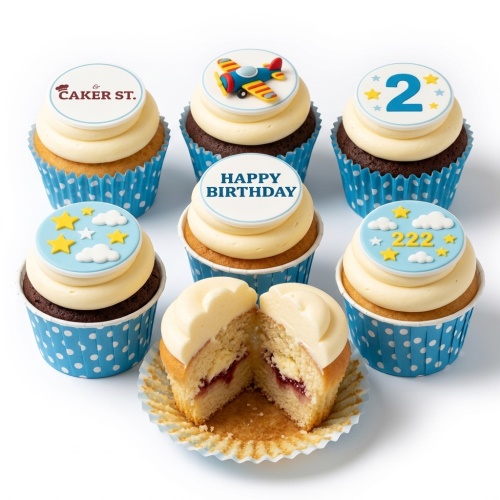Kids birthday cupcakes with airplane, stars, clouds, and 'Happy Birthday' toppers.