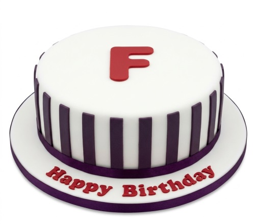 White round birthday cake with purple stripes, red initial 'F' and 'Happy Birthday' message.