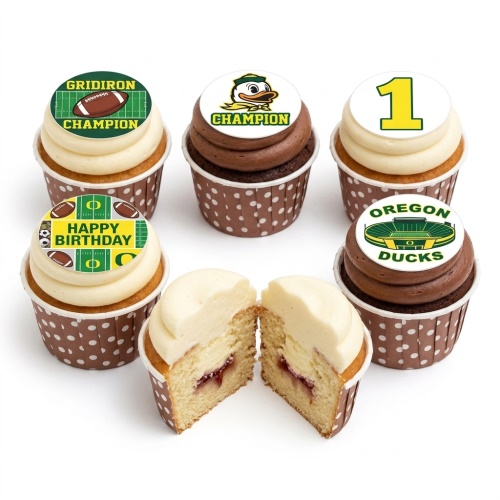 American football themed birthday cupcakes with edible toppers featuring a football field, Oregon Ducks mascot, and custom age '1'.