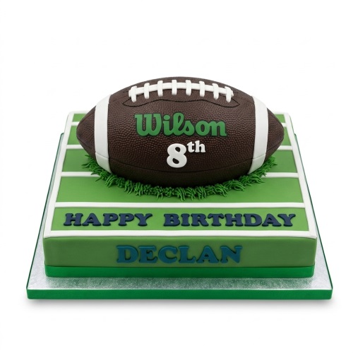 American football themed birthday cake on a green pitch with custom age and name.