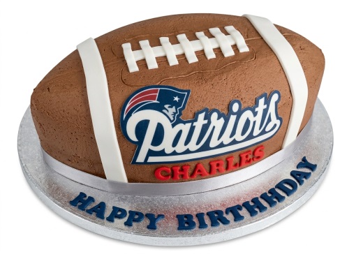 3D American football shaped birthday cake with New England Patriots logo and custom message.