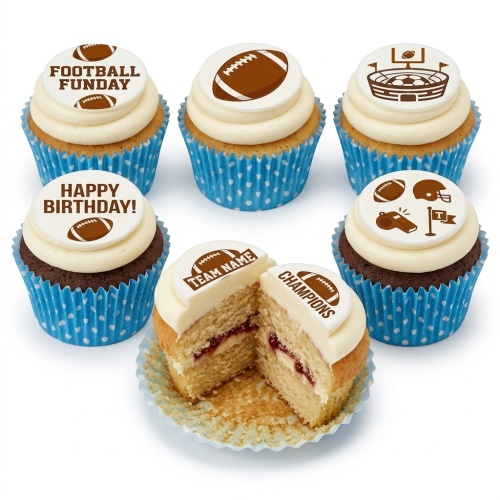 American football theme cupcakes with white frosting, blue polka dot wrappers, and edible toppers featuring footballs, a stadium, helmet, whistle, and flag.
