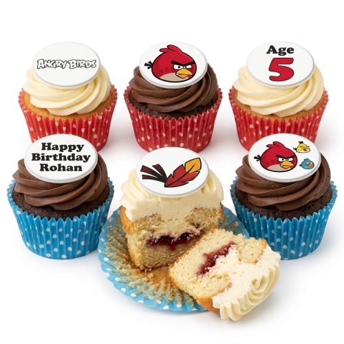 Six Angry Birds themed cupcakes with vanilla and chocolate frosting, some with jam filling, featuring character and logo toppers, and custom age and name examples.
