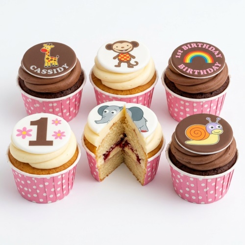 Set of 1st birthday cupcakes with animal toppers including giraffe, monkey, elephant, and snail, plus '1st Birthday' and '1' toppers.