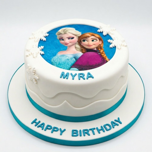 Round white Frozen theme birthday cake with Elsa and Anna edible image, snowflakes, and blue trim.