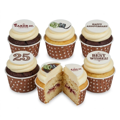 Assortment of celebration cupcakes with custom age and anniversary toppers, in chocolate and vanilla.