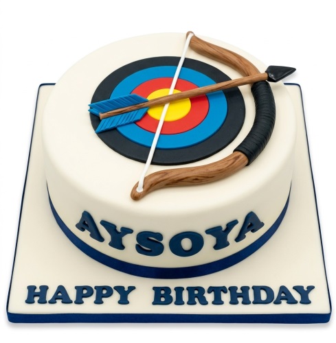 Round white birthday cake with an edible archery target, bow, and arrow on top, with a custom message.