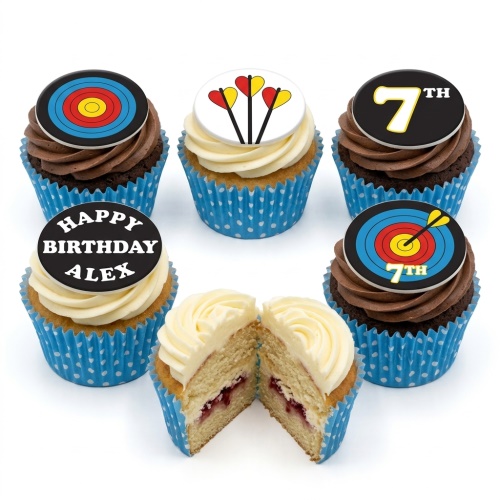 Archery themed birthday cupcakes with target and dart toppers, blue cases, and frosting.