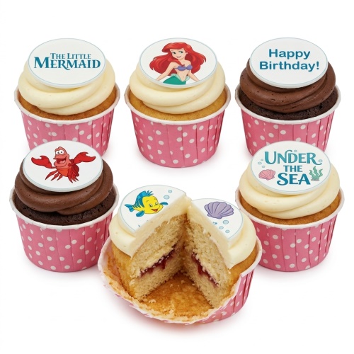 The Little Mermaid themed cupcakes with Ariel, Sebastian, Flounder, and 'Happy Birthday!' toppers.