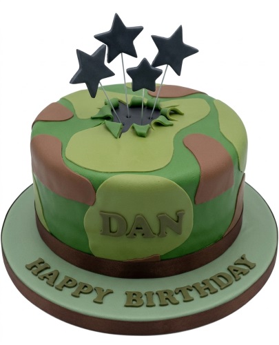 Round army camouflage birthday cake with green and brown pattern, topped with black star decorations.