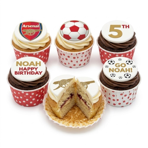 Six Arsenal football themed cupcakes with red and white polka dot cases, featuring Arsenal logo, footballs, a custom age topper, and personalised name and message toppers, one cupcake cut to show vanilla sponge and jam.