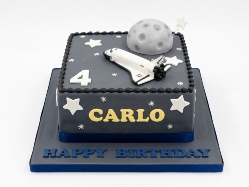 Square grey space theme birthday cake with white space shuttle, moon, and stars.