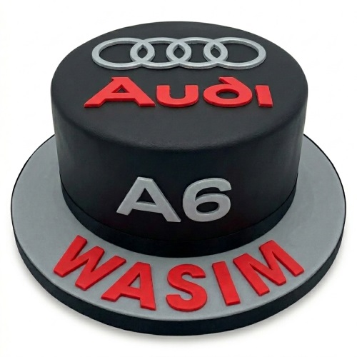 Black round Audi A6 car theme birthday cake with silver rings and red text on a grey board.