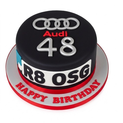 Round black Audi car theme birthday cake with silver logo, custom age, and personalised message.