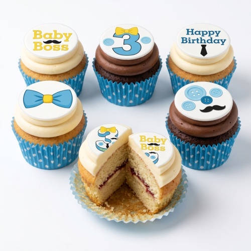 Baby Boss themed cupcakes with blue bow ties, mustaches, and a custom age topper.