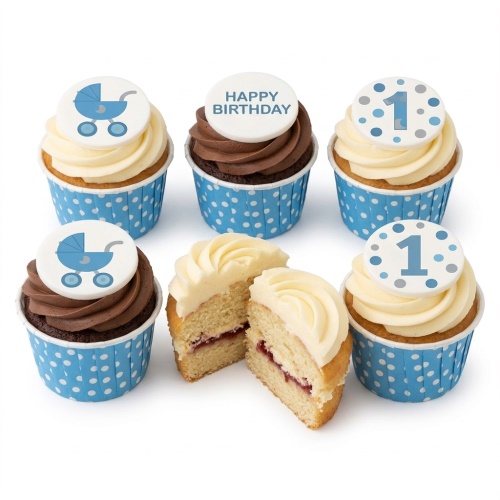 A set of vanilla and chocolate cupcakes with blue polka dot wrappers, topped with white frosting and edible toppers featuring blue baby carriages, the number '1', and 'Happy Birthday' text.