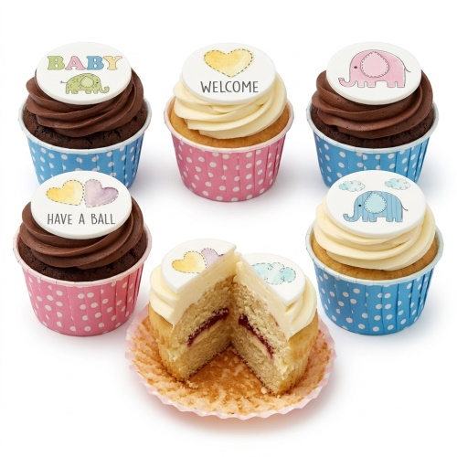 Six baby shower cupcakes with elephant and heart toppers, in pink and blue polka dot cases, some with chocolate frosting and some with vanilla frosting.