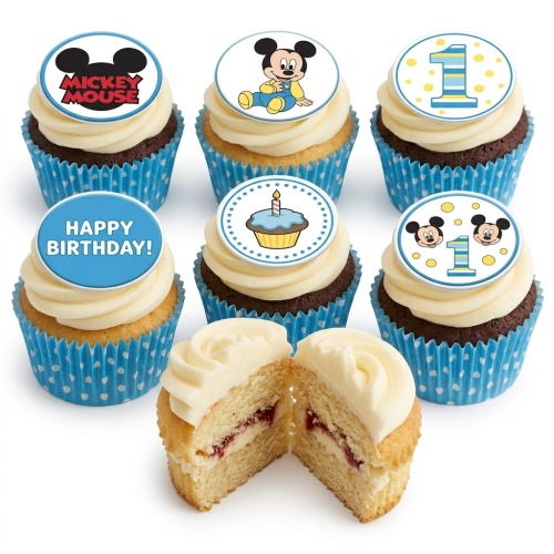 Mickey Mouse and Baby Mickey 1st birthday cupcakes with blue polka dot cases and white frosting.