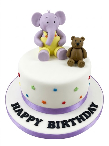 White birthday cake with purple elephant, brown teddy bear, multicoloured stars, and 'Happy Birthday' message.