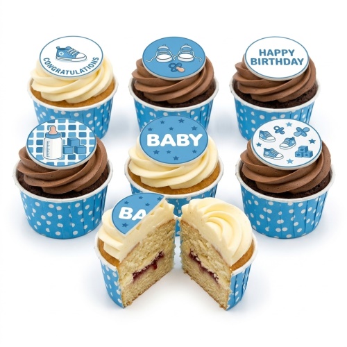 Blue and white baby shower cupcakes with baby shoes, bottle, and block toppers.