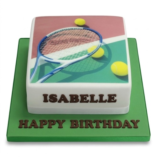 Square white fondant cake with an edible image of a tennis racket and yellow tennis balls on a green and clay court.