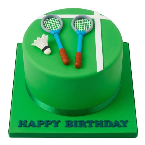 Round green badminton themed birthday cake with edible rackets and shuttlecock.