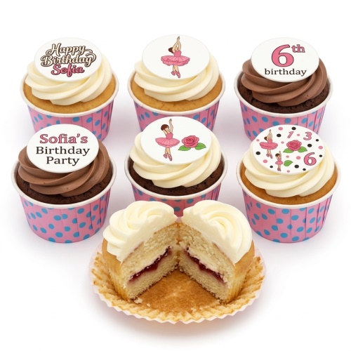 Set of ballerina themed birthday cupcakes with pink and white frosting, featuring ballerina and rose toppers, and polka dot cases.