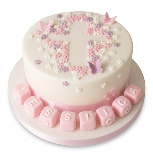 Round white Christening cake with pink and purple floral cross, butterflies, and pink custom name blocks.