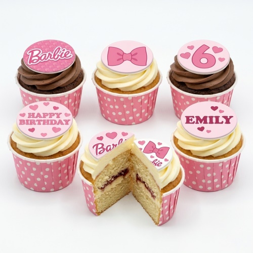 Barbie themed cupcakes with pink bows, hearts, and custom age and name toppers.