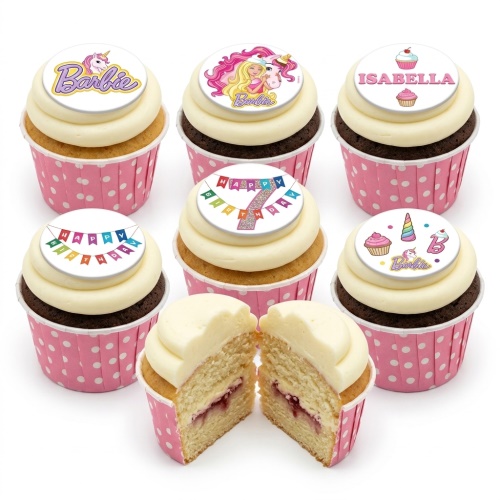 Barbie and unicorn themed birthday cupcakes with white frosting and pink polka dot wrappers.