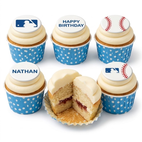 Six vanilla cupcakes with white frosting, blue polka dot wrappers, and baseball-themed edible toppers, including an MLB logo, a baseball, and 'Happy Birthday' and 'Nathan' messages.