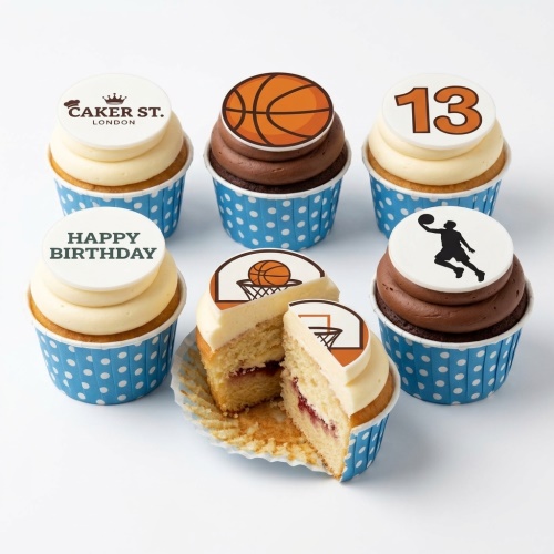 Basketball themed birthday cupcakes with orange basketballs, hoops, player, and custom age topper.