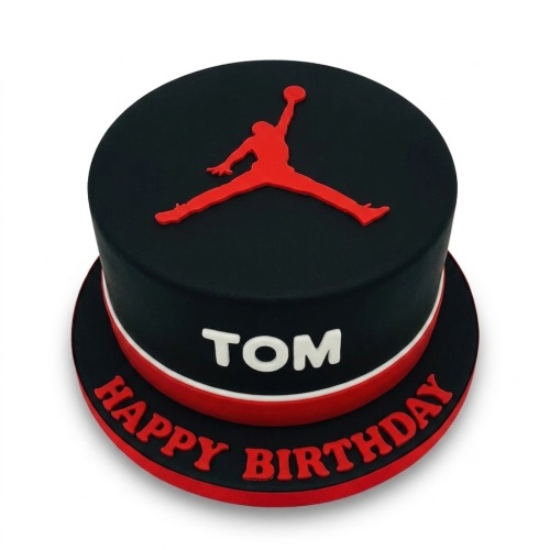 Round black cake with red Jordan Jumpman logo, red and white stripe, and space for a personalised name.