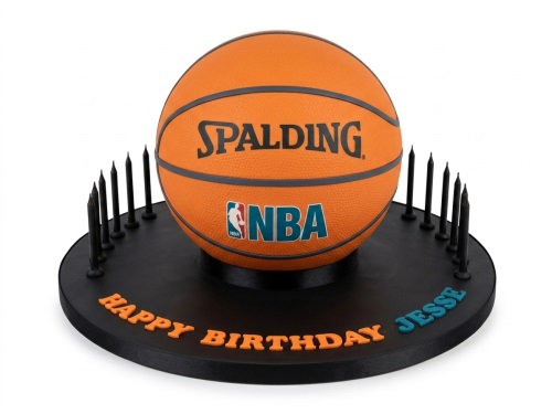 3D NBA basketball cake on a black cake board with black candles and a custom 'Happy Birthday' message.