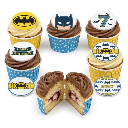 Batman themed birthday cupcakes with various edible toppers including the Batman logo, Batman's face, a utility belt, a custom age number, and a 'Happy Birthday' message.