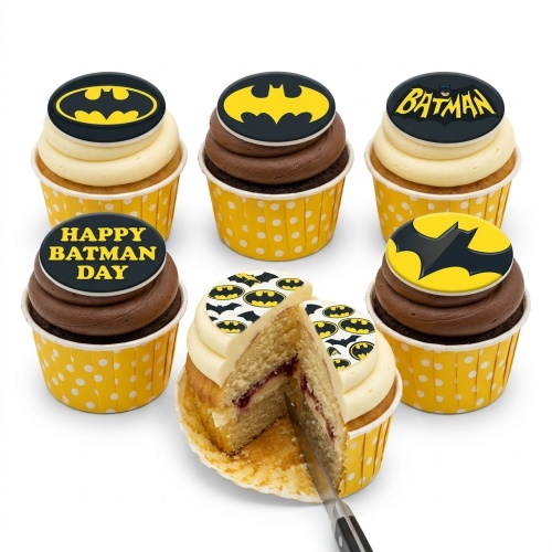 Six Batman themed cupcakes with yellow and black bat signal toppers, some with chocolate and vanilla frosting.