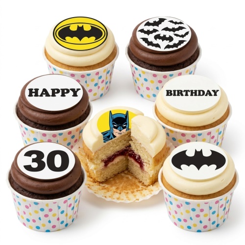 A set of Batman themed birthday cupcakes with Bat-Signal, bat symbols, Batman face, and custom age topper.