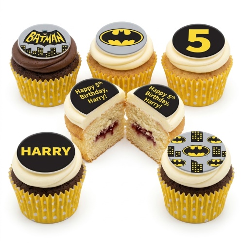 Batman themed cupcakes with various logos, cityscape, custom age topper, and personalised name topper.