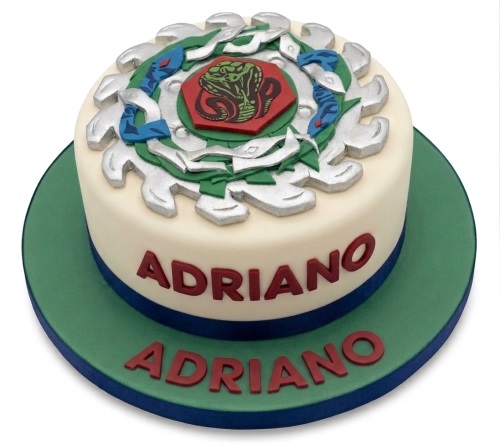 Round Beyblade themed birthday cake with a detailed spinning top topper and personalised name.