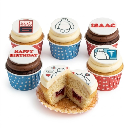Big Hero 6 Baymax themed birthday cupcakes with character and logo toppers, some with custom messages.