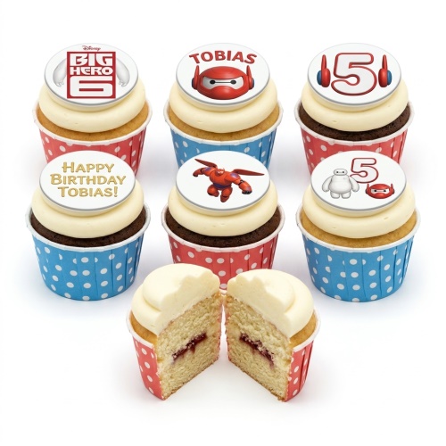 Big Hero 6 themed cupcakes with Baymax and logo toppers, red and blue polka dot cases, custom age and name.