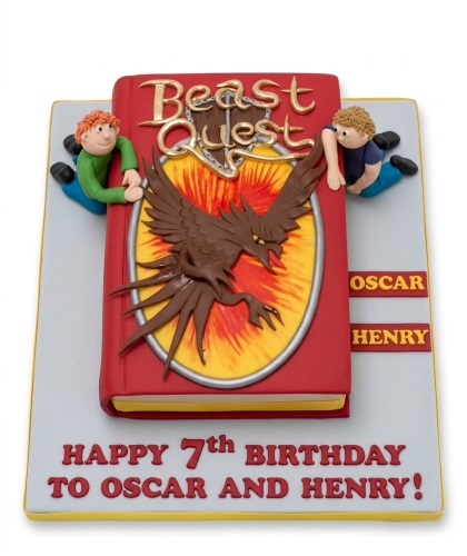 Beast Quest themed birthday cake shaped like a book with character figures and custom age message.