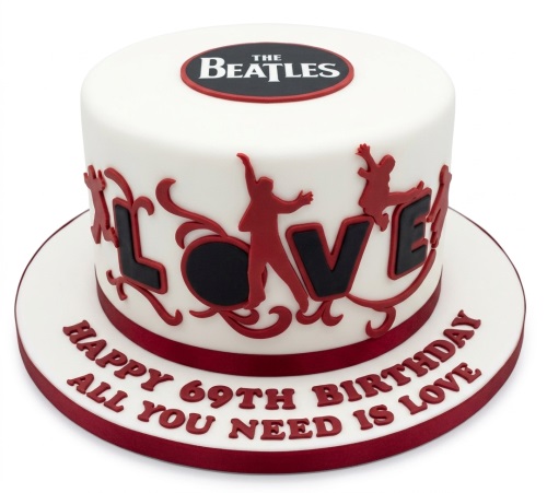 White round cake with The Beatles logo, red band silhouettes, and "LOVE" in black and red.