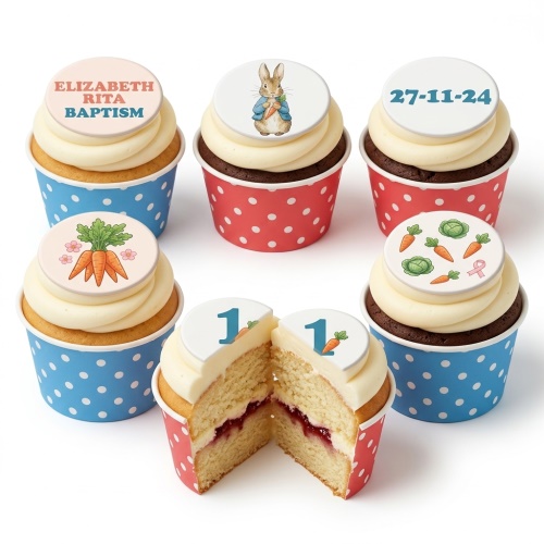Peter Rabbit themed cupcakes with edible toppers, including Peter Rabbit, carrots, and a number one.