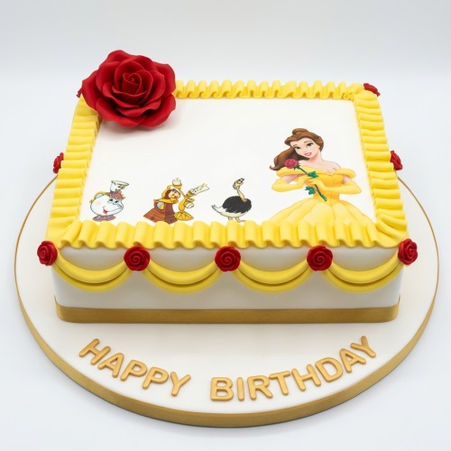 Square white cake with Belle Disney Princess edible image, yellow ruffles, and red sugar roses.