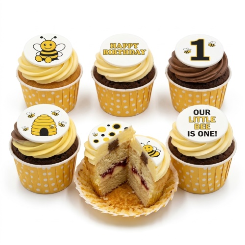 Bee theme 1st birthday cupcakes with yellow and chocolate frosting, bee and beehive toppers.