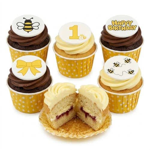 Yellow and white bee themed birthday cupcakes with a number one topper, a bow, and "Happy Birthday" message.
