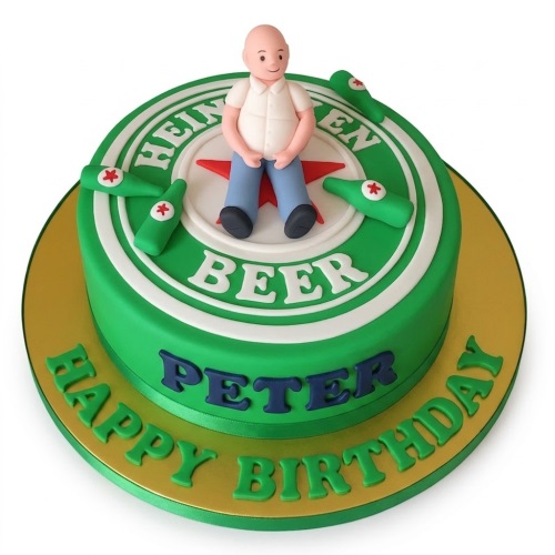Green round birthday cake with Heineken logo, a male figure, and miniature beer bottles, with a personalised name.