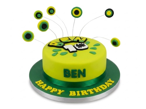 Vibrant green Ben 10 themed birthday cake with circular toppers and custom message board.